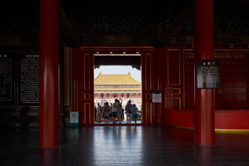 Door framed view of the Forbidden City imperial palace complex, Beijing, China