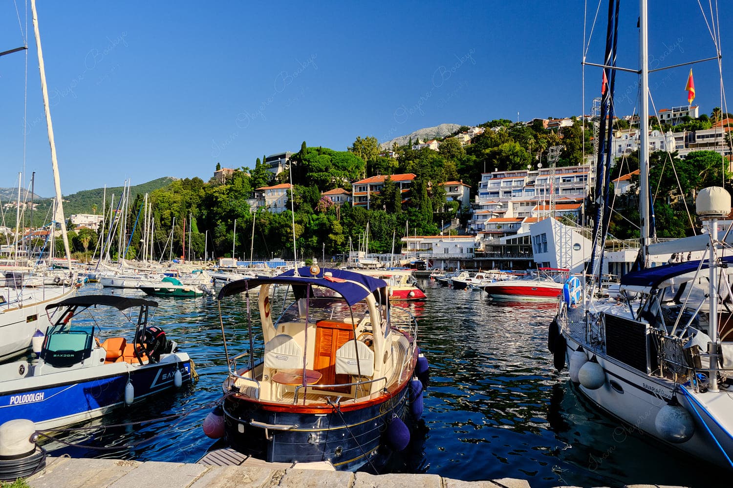 Marina view of bobbing boats and mountains, Herceg Novi, Montenegro Marina view of bobbing boats and mountains, Herceg Novi, Montenegro