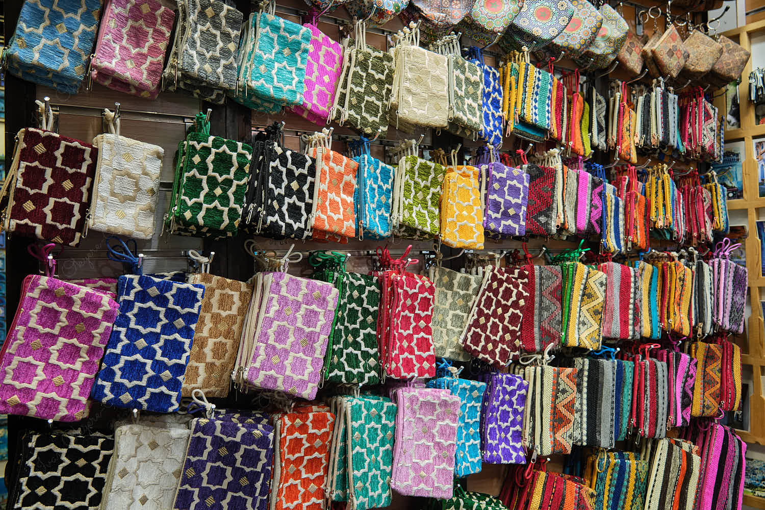 Closeup of beautiful colorful multicolor and multipattern ladies purses at souvenirs stall, Chefchaouen, Morocco