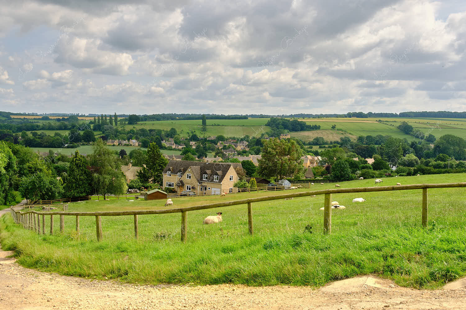 Beautiful panoramic view from the Cotswold Way walking trail of the picturesque lush green Chipping Camden English countryside landscape, Cotswolds, Gloucestershire, England, UK