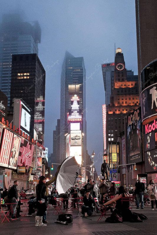 Model fashion photo shoot at night in Times Square, New York, America