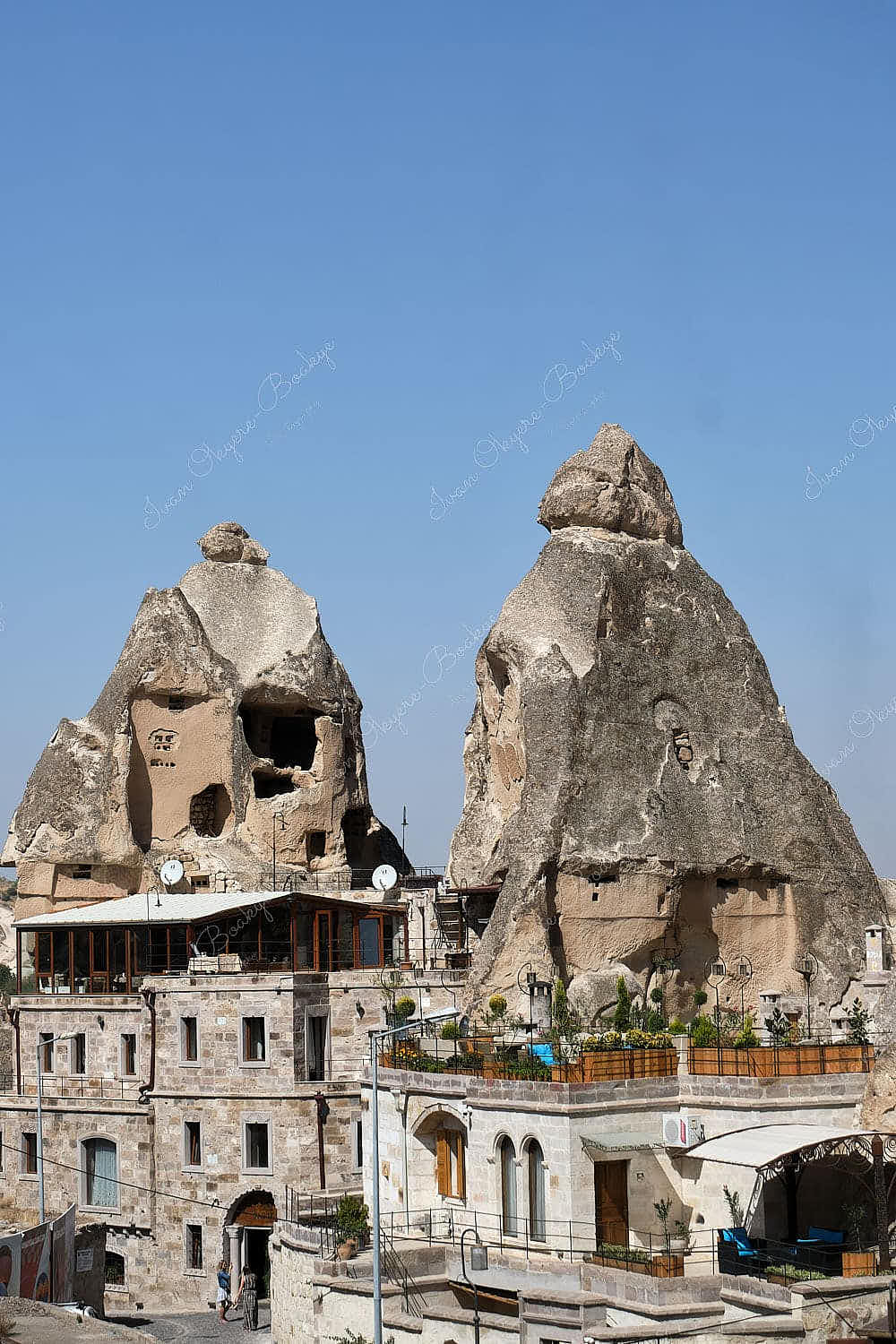 View of boutique cave hotel built around fairy chimney ruins, Cappadocia, Turkey