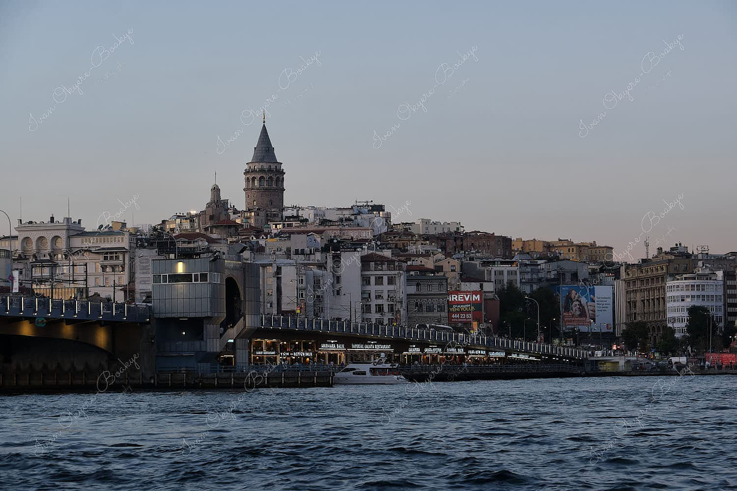 View of Galata Tower and restaurants under the Galata Bridge, Istanbul, Turkey