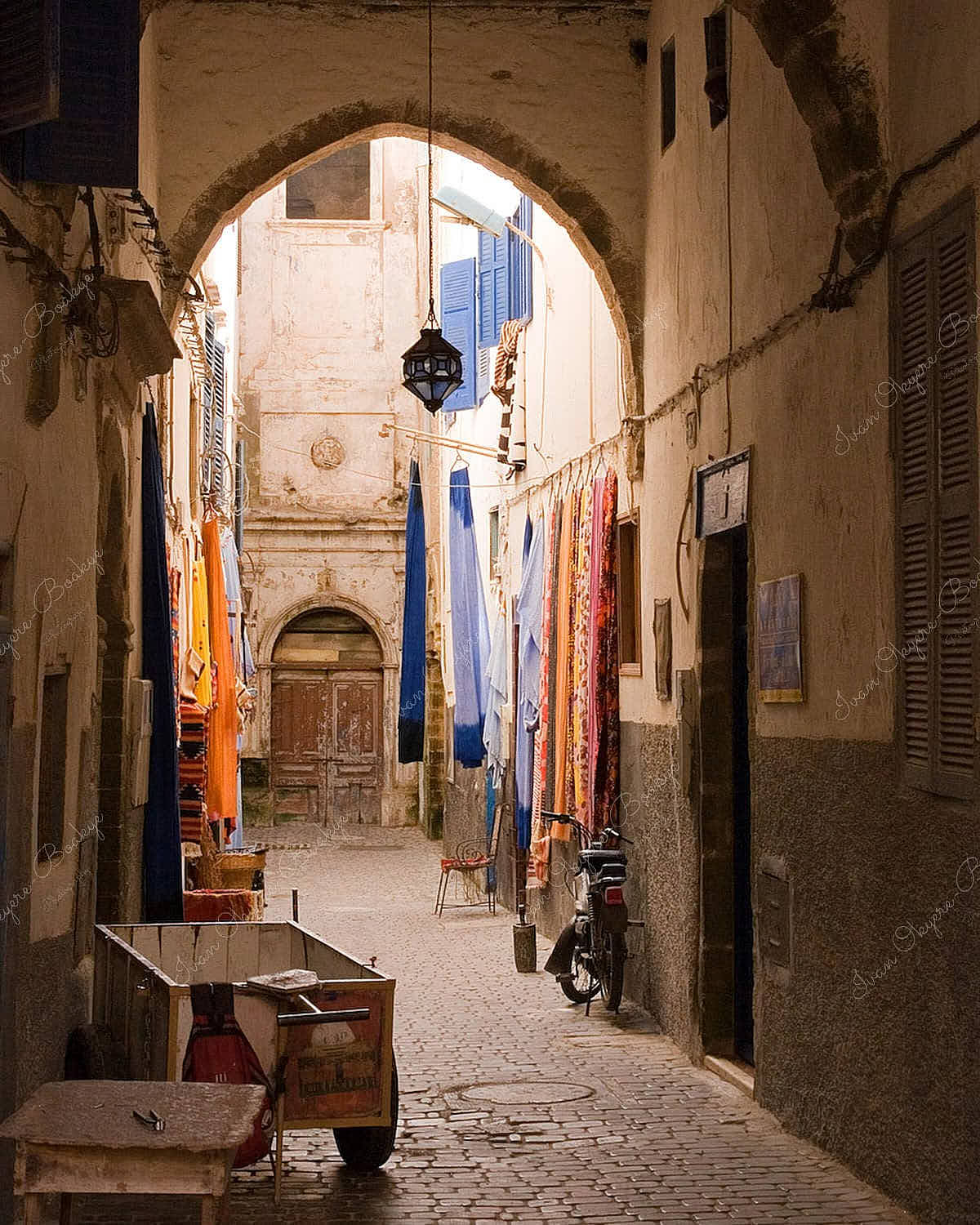 Colourful sheets hanging outside in a Medina side street in Essaouira, Morroco
