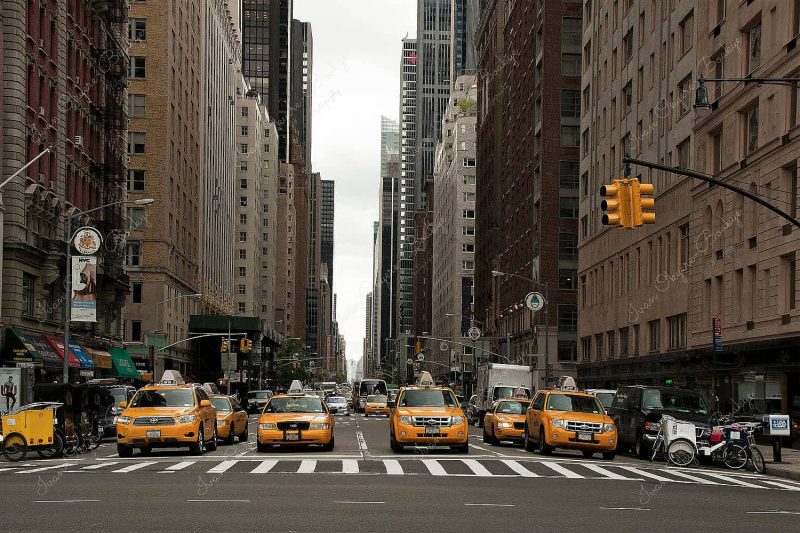 Yellow cabs waiting at traffic lights in New York, America