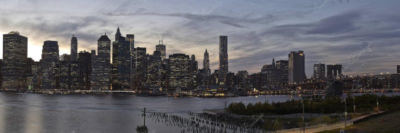 Manhattan skyline and Brooklyn Bridge panorama at dusk in New York, America
