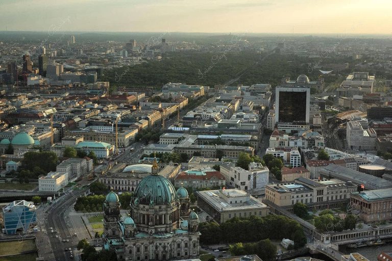 Panoramic view of Berlin cityscape, Berliner Dome and Brandenburg Gate at sunset from the Fernsehturm, Berlin, Germany