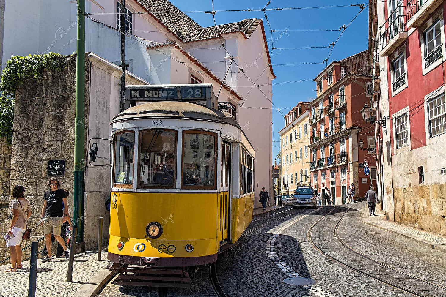 Yellow Tram in the streets of Alfama, Lisbon, Portugal