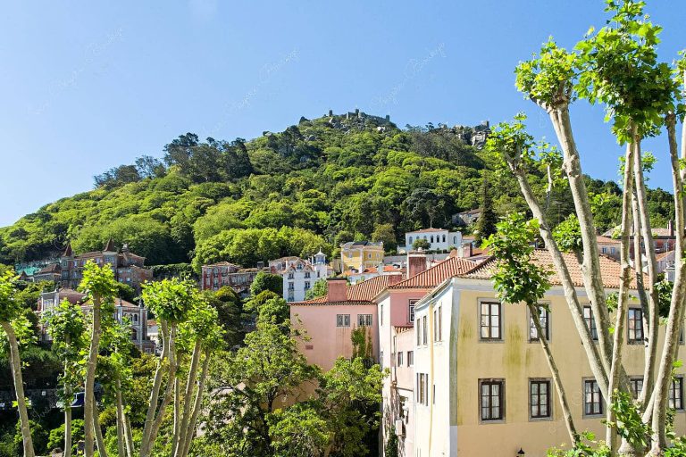 View of the colourful pastel coloured buildings and mountain in Sintra, Lisbon, Portugal