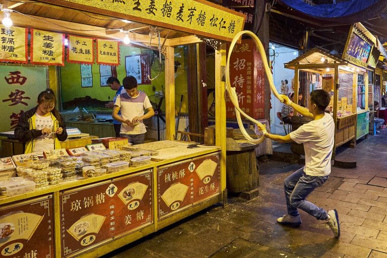 Market street food stall selling desserts in the Muslim Quarter, Xi’an, China