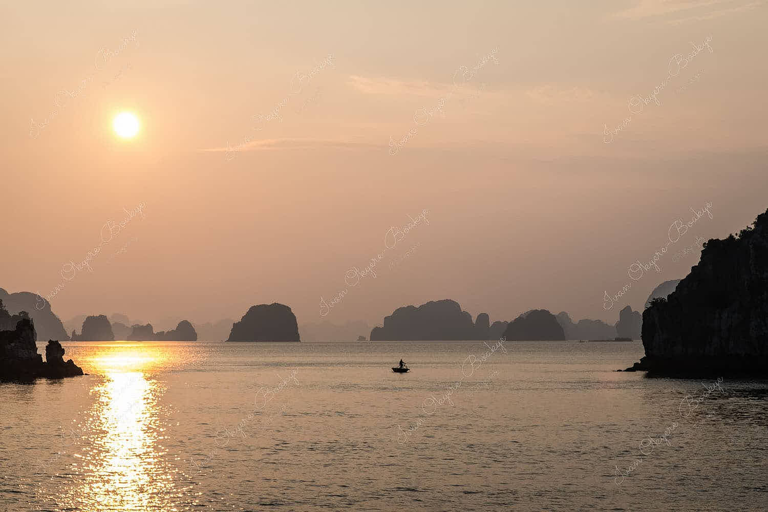 Fishing boats at sunset in Halong Bay, Vietnam