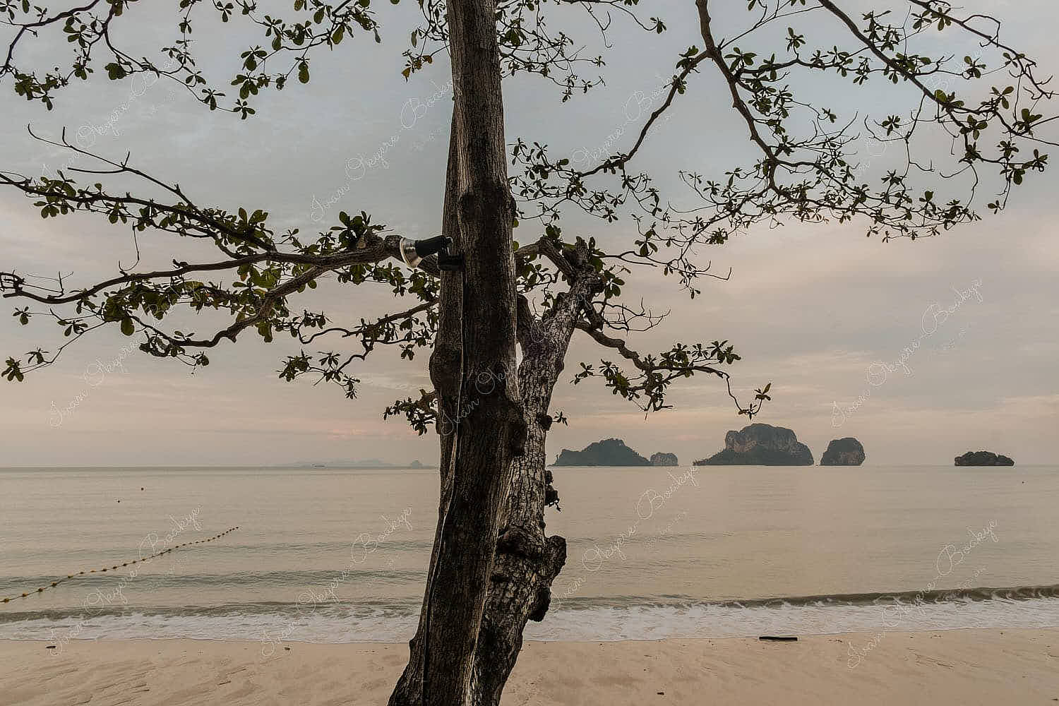Empty Hat Tham Phra Nang beach at sunrise in Railey, Krabi, Thailand