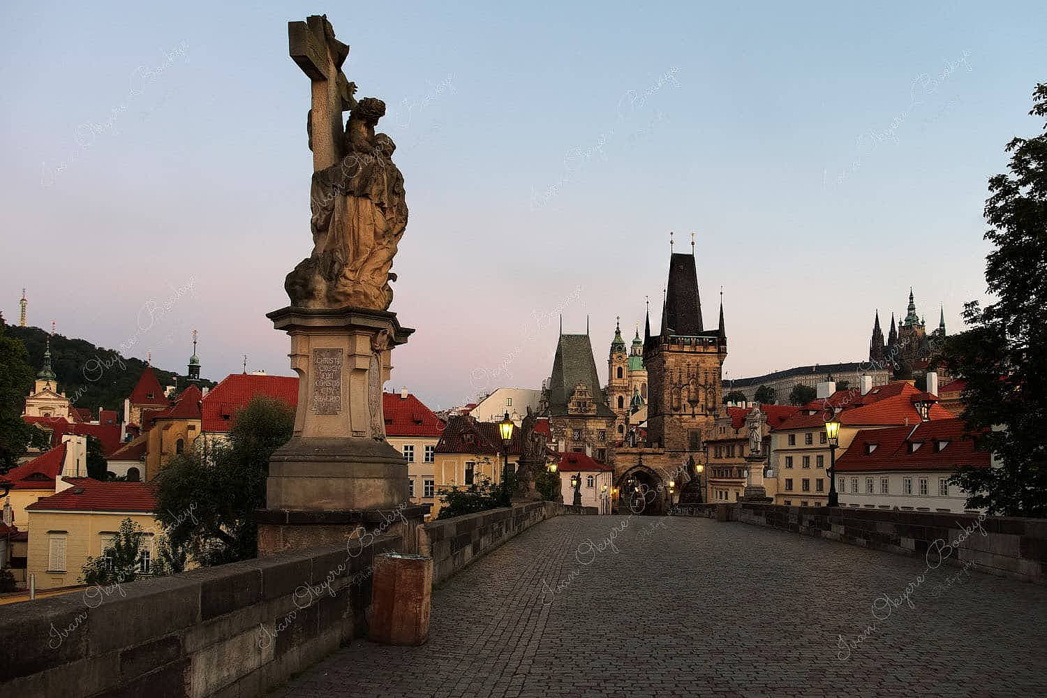 The famous Charles Bridge (Karluv Most) at sunrise in Prague, Czech Republic