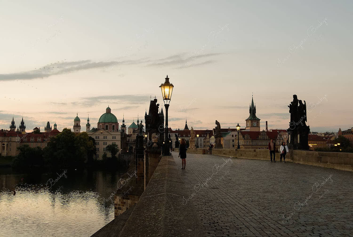 The famous Charles Bridge (Karluv Most) at sunrise in Prague, Czech Republic