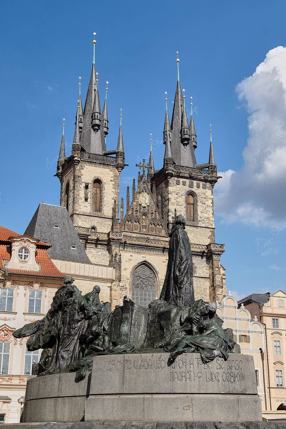 The Jan Hus monument and Church of Our Lady before Týn in the Old Town Square of Prague, Czech Republic