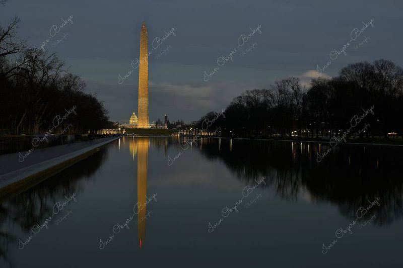 Sunset view of Washington Monument and Capitol building reflections in the Lincoln Memorial Reflecting Pool, Washington, America