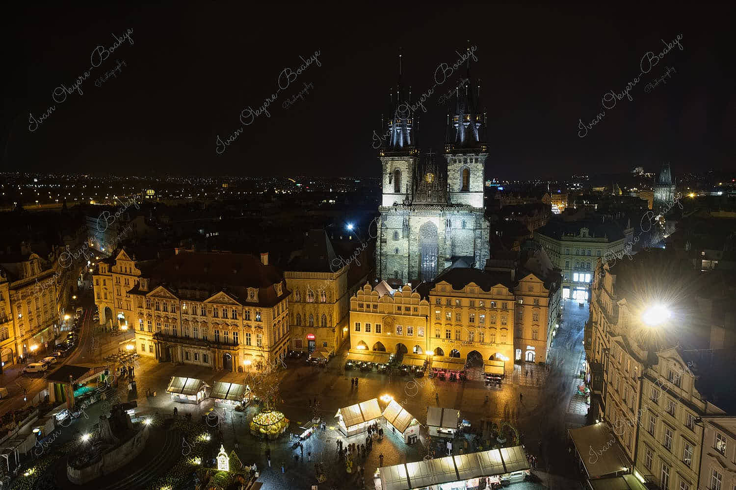 Night time panoramic view of the Jan Hus monument and Church of Our Lady before Týn in the Old Town Square of Prague, Czech Republic