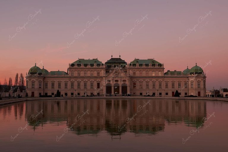 View of Belvedere Castle and pool reflection at sunset, Vienna, Austria
